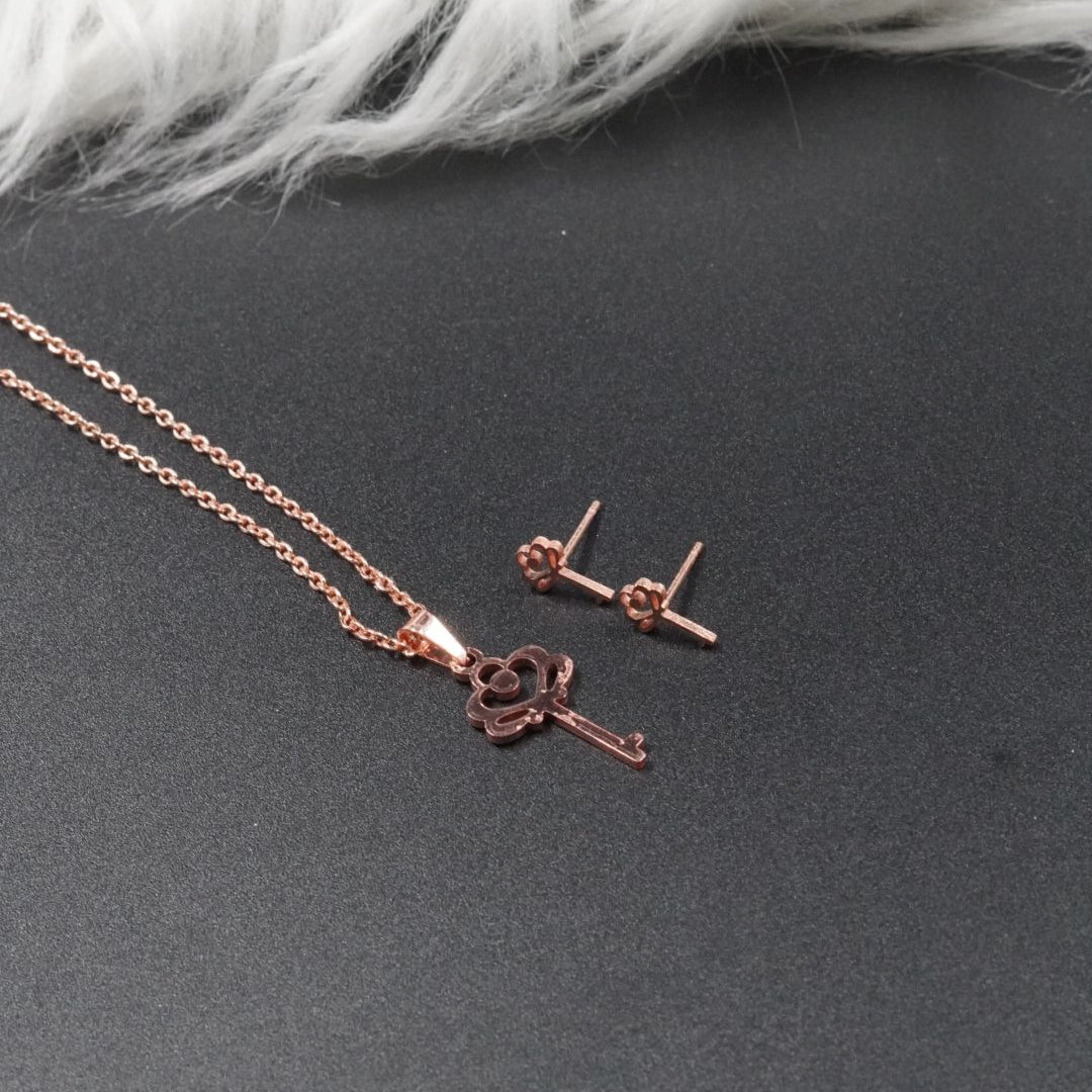 COMBO CADENA+DIJE+ARETE ECO LLAVE ROSADO